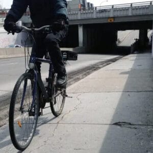 cyclist riding on sidewalk