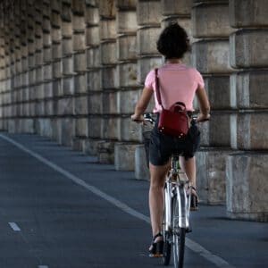 cyclist riding on road shoulder
